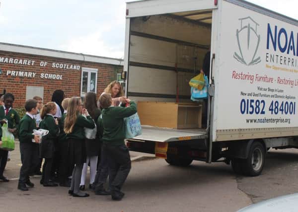 Students at Luton's St Margaret of Scotland share their harvest with homeless charity NOAH