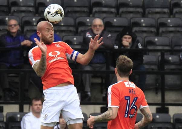 Hatters skipper Scott Cuthbert clears his lines against Notts County
