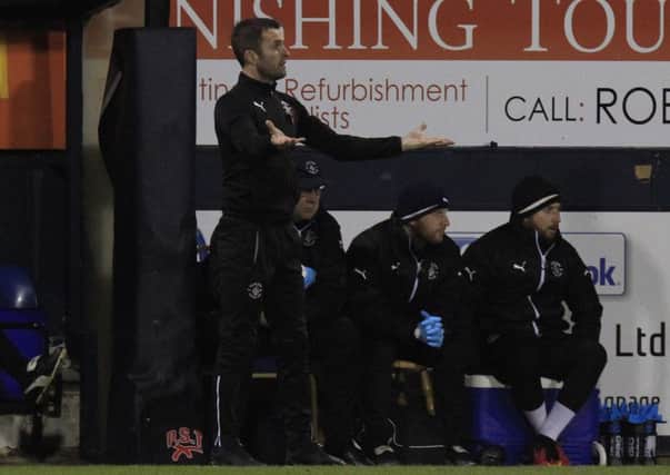 Hatters boss Nathan Jones watches on against Millwall