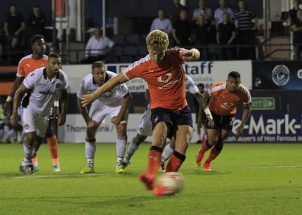 Cameron McGeehan scores from the spot against Newport earlier this season
