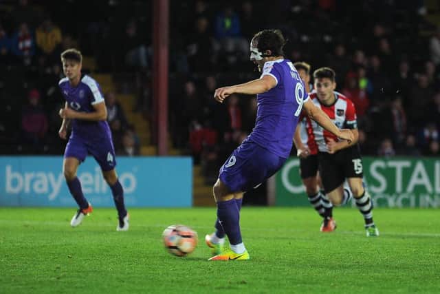 Danny Hylton converts his second penalty at Exeter