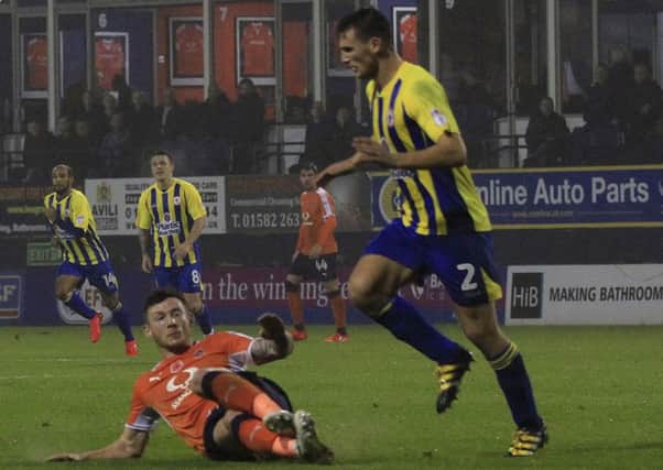 Jordan Cook is about to see red for Luton on Saturday