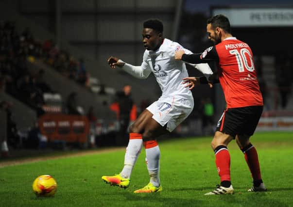 Pelly-Ruddock Mpanzu plays the ball wide against Morecambe