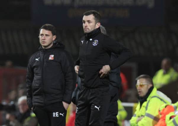 Hatters boss Nathan Jones watches on against Swindon