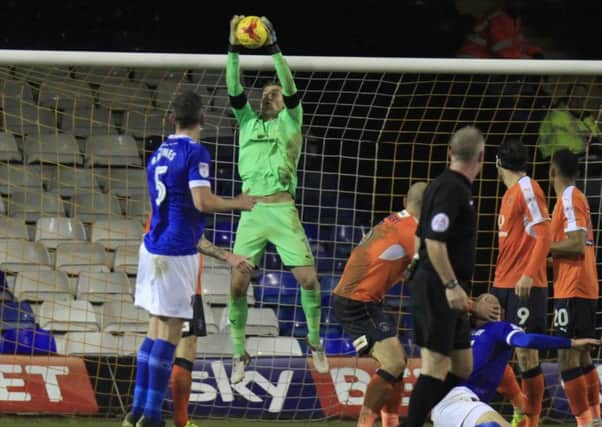 Hatters keeper Christian Walton claims the ball against Carlisle on Saturday