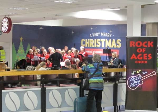 Oldies choir Rock of Ages entertain passengers at Luton  Airport arrivals hall