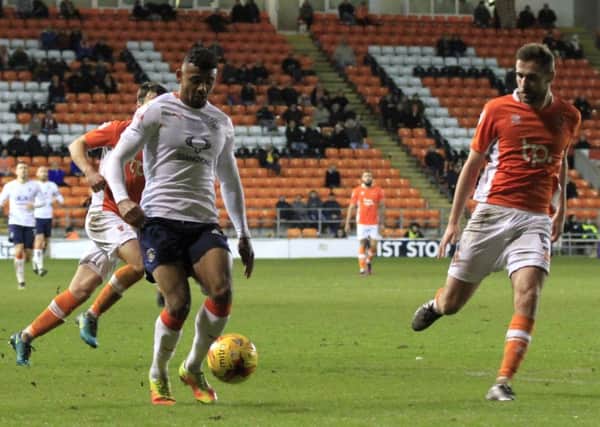 Hatters striker Isaac Vassell has signed a new deal at the club