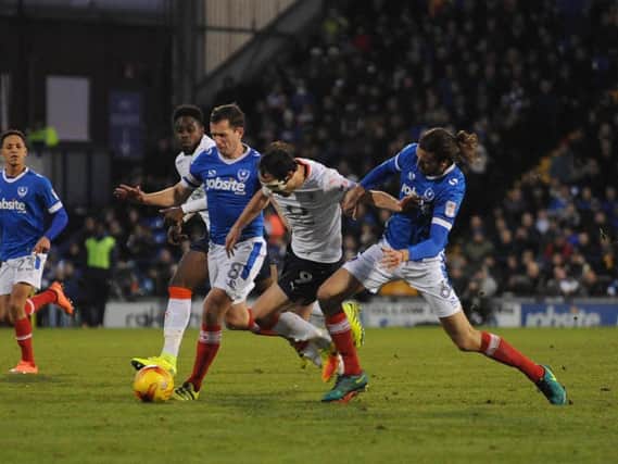 Danny Hylton battles for possession against Portsmouth this afternoon