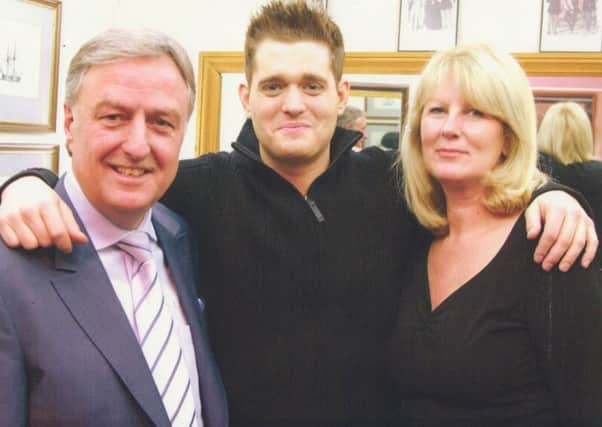 Top tailors Geoff and Laura Souster with Michael Buble