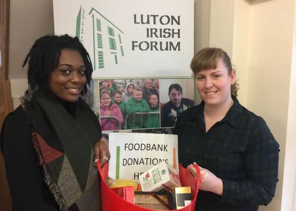 Brogan Lewis (left) and Heather Roy with some of the items collected by Luton Irish Forum for the Foodbank.