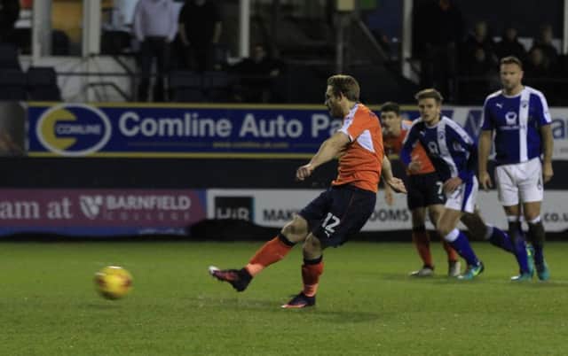On the spot: Craig Mackail-Smith converts his penalty against Chesterfield on Tuesday night