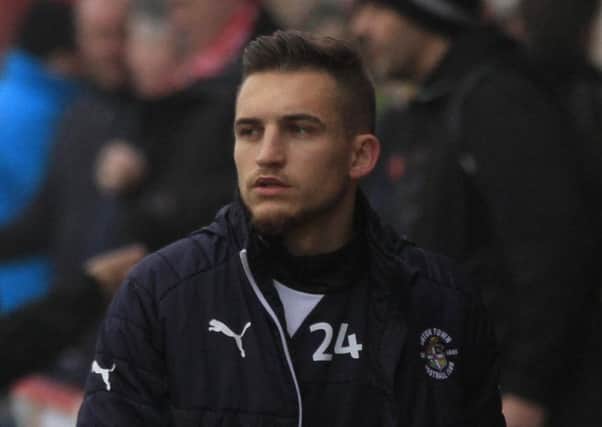 Luton new boy Lawson D'Ath watches on against Accrington
