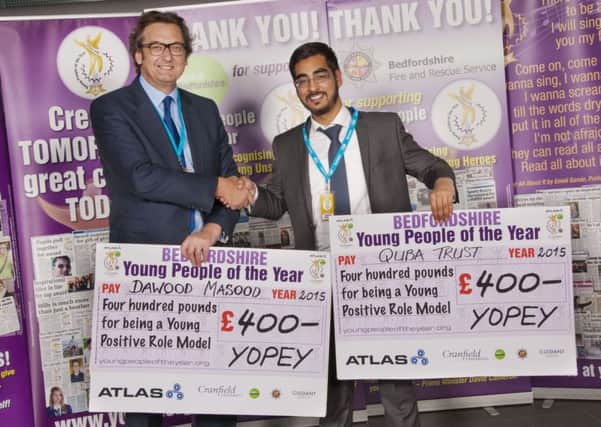 Quba Trust director Dawood Masood pictured right winning a 2015 YOPEY award