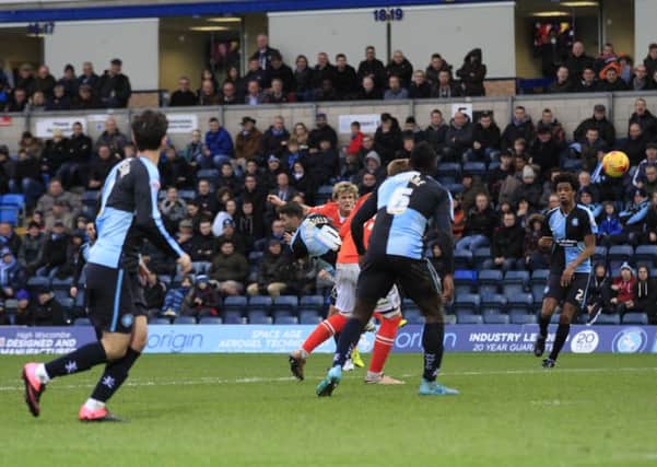 Cameron McGeehan scores the only goal against Wycombe last season