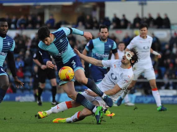 In the wars: Danny Hylton takes another blow against Wycombe this afternoon