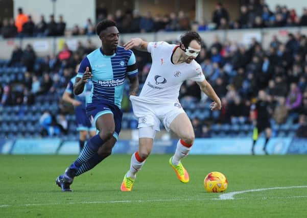 Danny Hylton is pulled back against Wycombe on Saturday