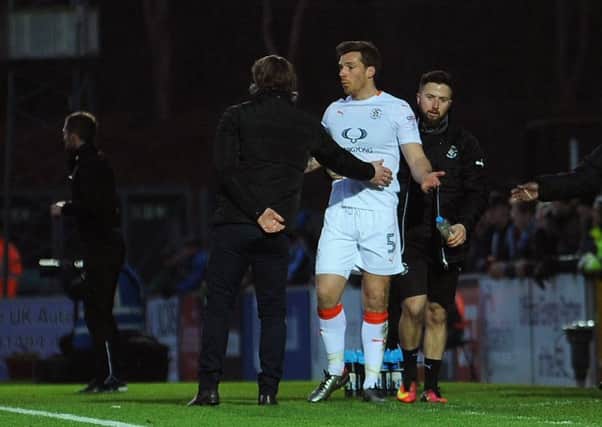 Johnny Mullins trudges away after being sent off against Wycombe