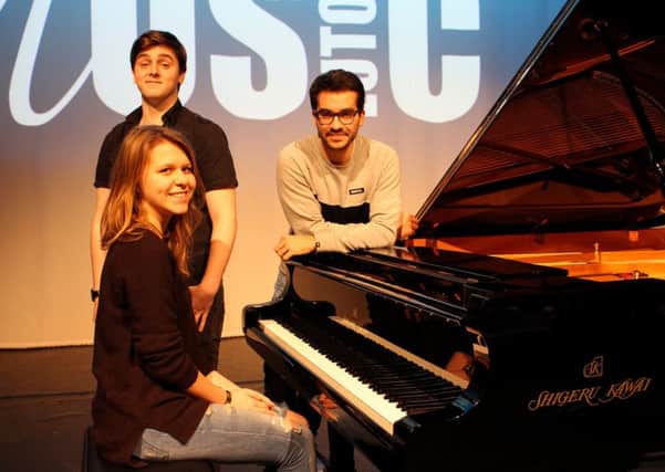 Acclaimed classical pianist Juan Perez Floristan with Luton Sixth Form College students Toma Junickaja (seated) and Oskar Blake