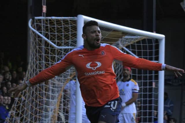 Isaac Vassell celebrates putting Luton in front against Cambridge United