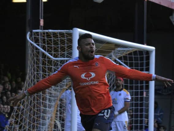 Isaac Vassell celebrates putting Luton in front against Cambridge United