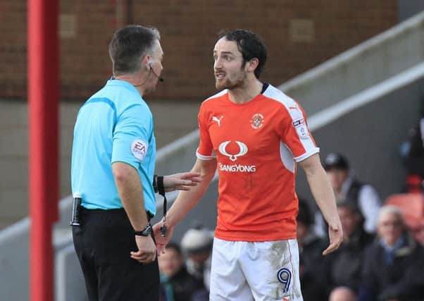 Striker Danny Hylton can't believed he's been booked at Grimsby