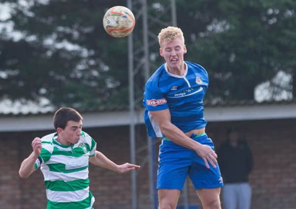 Connor Calcutt climbs highest against Aylesbury United - pic: Greg Childs