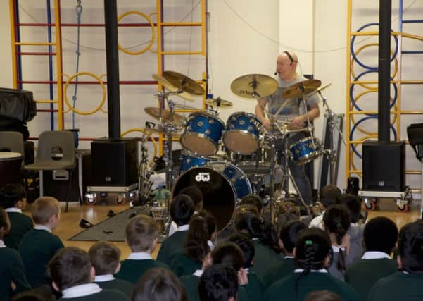 Ex Status Quo drummer Jeff Rich gave a percussion workshop to lucky pupils at Luton's Norton Road Primary School