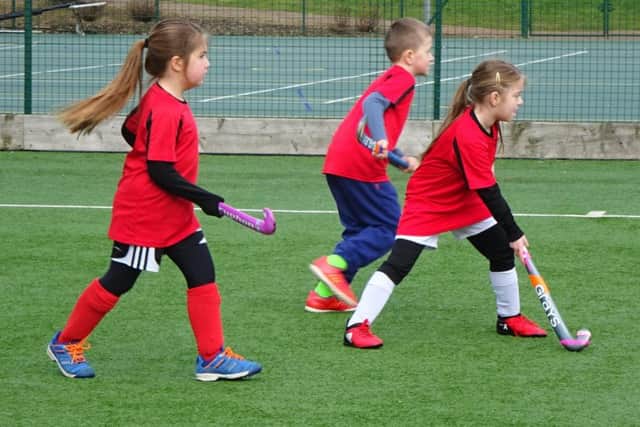 Luton U8s Sophie Starkey, Molly Reeves and James Whiting in action