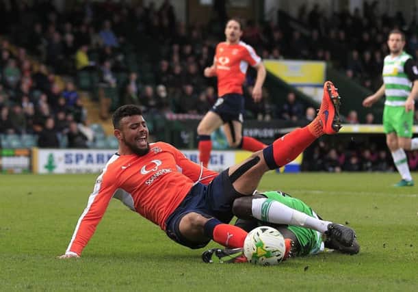 Isaac Vassell is fouled for Luton's seventh minute penalty on Saturday