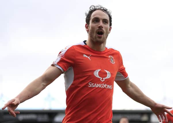 Hatters striker Danny Hylton celebrates another goal at Yeovil on Saturday