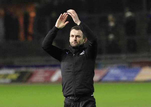 Hatters boss Nathan Jones applauds Town's travelling supporters on Tuesday night