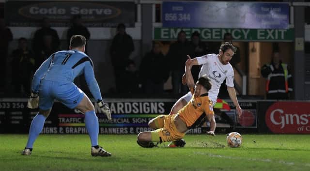 Hatters striker Danny Hylton is felled for Town's penalty at Newport