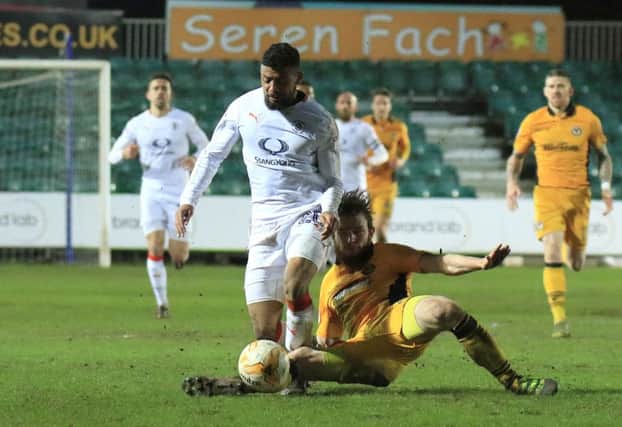 Isaac Vassell is brought down Newport's Mark O'Brien as the ex-Hatter saw red on Tuesday night