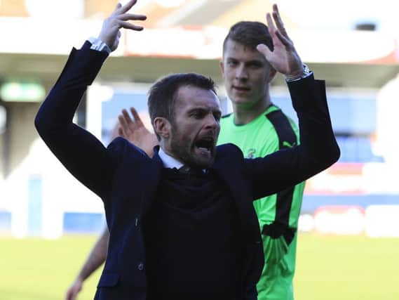 Hatters boss Nathan Jones celebrates his side late win over Blackpool
