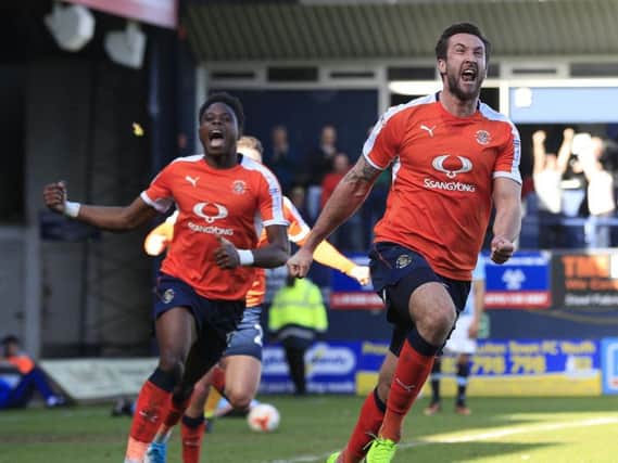 Ollie Palmer wheels away in pure delight after scoring the winner against Blackpool