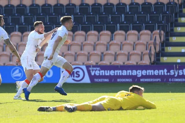 Olly Lee wheels away after scoring his first goal of the season at Barnet