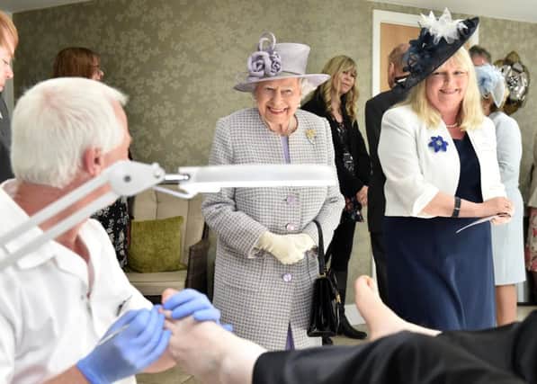 The Queen inspects the activities on offer at Priory View