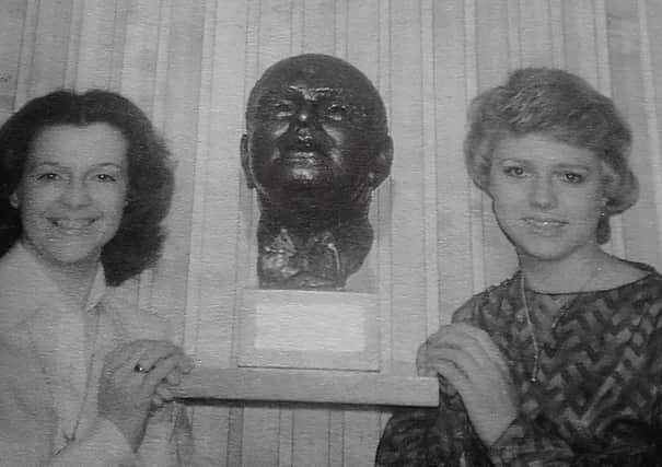 A bust of Arthur E Davies by Dora Barrett is unveiled with a member of Luton Girls Choir on each side -  Lynda Janes (left) and Alison Nicola. This picture appeared in the Luton News in June 1979
