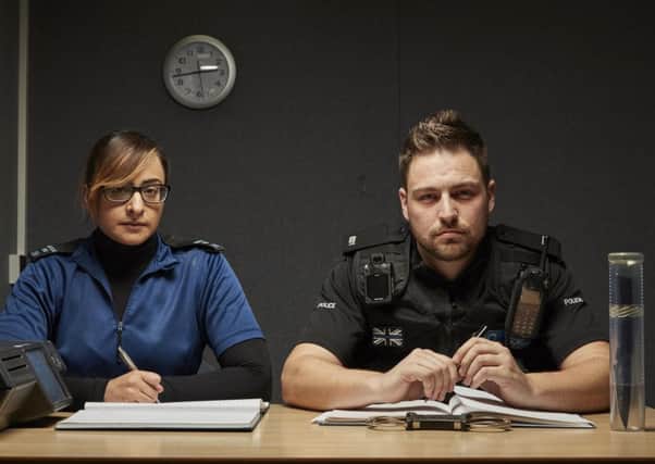 Investigating Officer Nash Hussain and PC Mark Paul during an episode of the documentary