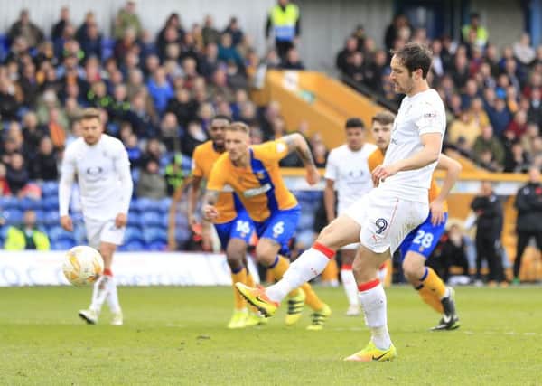 Danny Hylton scores from the spot against Mansfield
