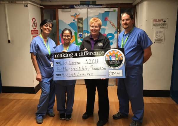 Molly Patel from Nisa Local donated the cheque from the store to some of the staff from the Neonatal Intensive Care Unit