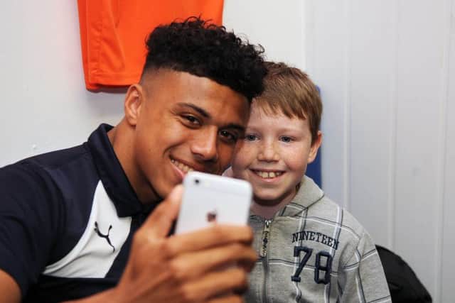 James Justin meets a young Hatter before the game