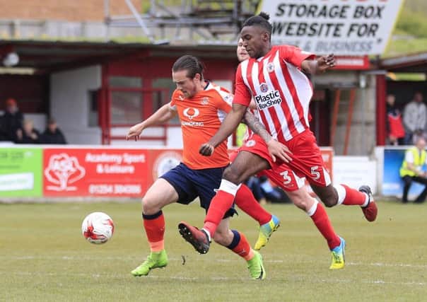 Town striker Jack Marriott holds off Stanley defender Omar Beckles