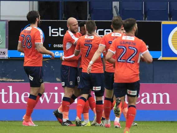Hatters celebrate Isaac Vassell's opener against Morecambe this afternoon