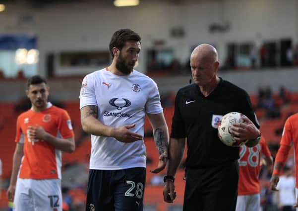 Ollie Palmer questions official Nigel Miller during Luton's 3-2 defeat last night