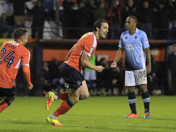Town striker Danny Hylton celebrates his goal from the penalty spot against Blackpool