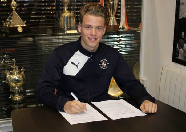 Kavan Cotter put pens to paper on his first pro deal at Luton