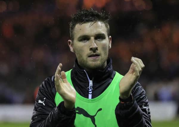 Stephen O'Donnell applauds the Town fans after defeat to Blackpool in the play-offs