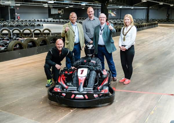 Perry McCarthy - The Stig (left), joined the Deputy Mayor of Dunstable councillor John Kane and Houghton Regis councillor Joanna Hillyard at the official opening of Teamsport Indoor Karting in Dunstable