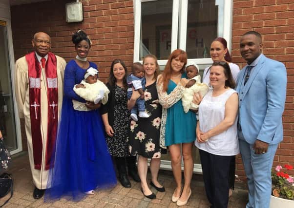 The triplets with their parents and the nurses from the Luton and Dunstable Hospital NICU on their Christening day